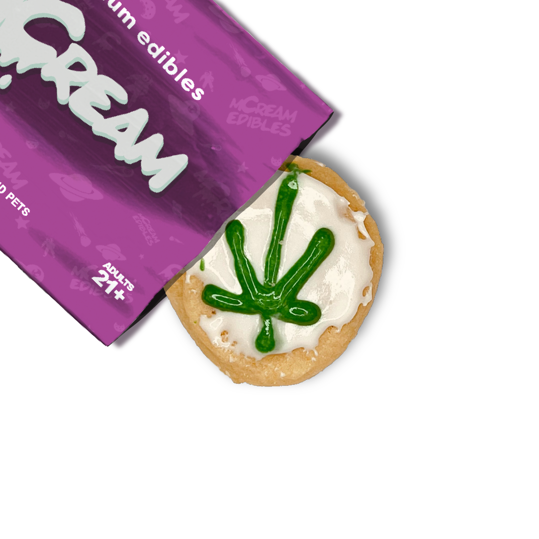 mCream THC-infused sugar cookie with green cannabis frosting design, shown with branded edibles pouch