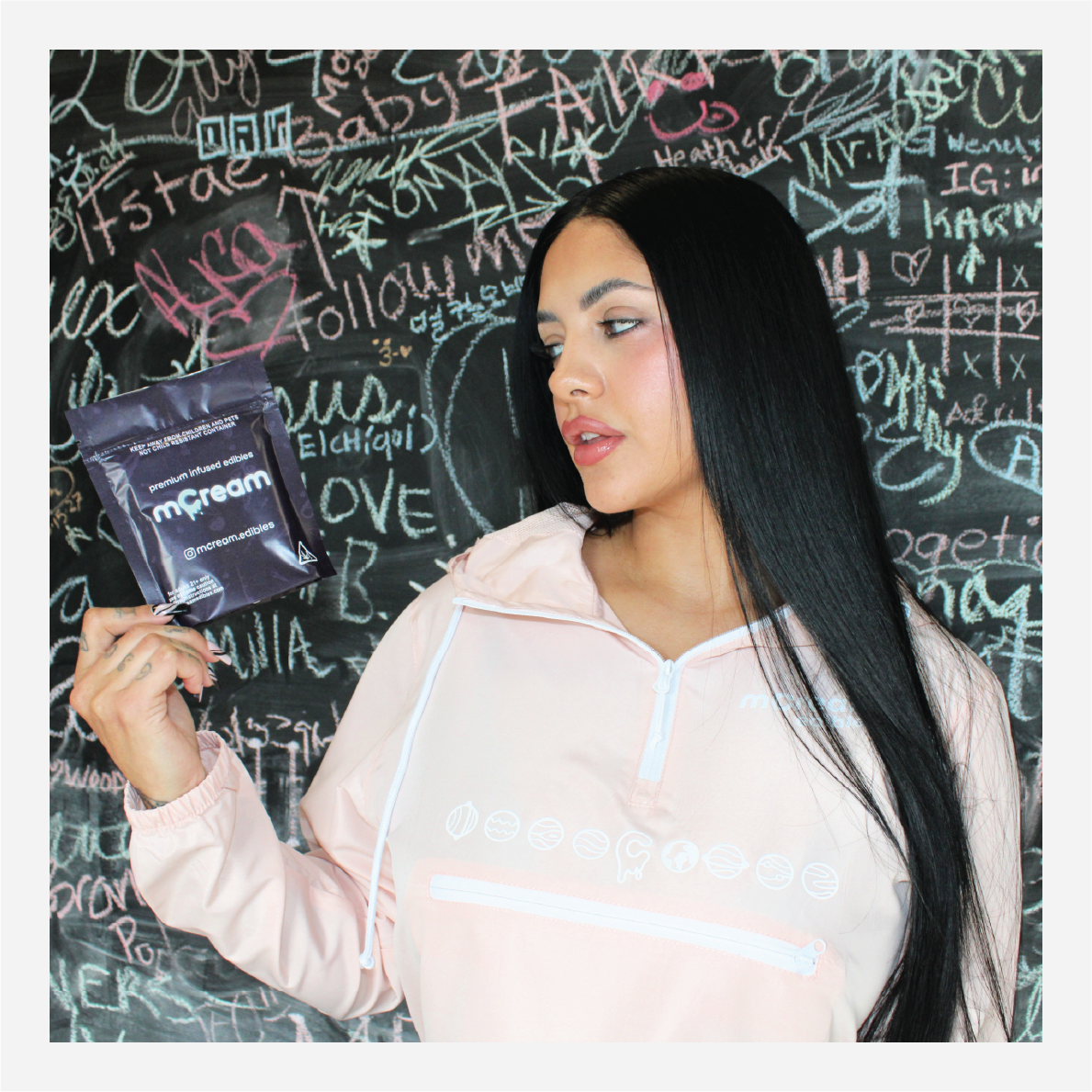 mCream Merch - Model wearing mCream cap and sweatshirt